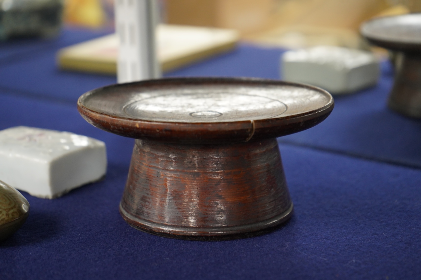 Two 19th century Korean ceramic water droppers and a Korean turned wood cup stand, oval water dropper 8cm long